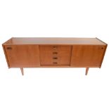 A mid-century stained teak sideboard with two sliding doors flanking four central drawers, raised on