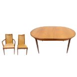 G-PLAN; a Fresco teak dining suite comprising oval extending dining table with extra leaf, length
