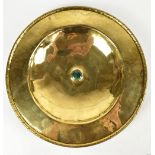 A Scottish Arts & Crafts brass charger with rope twist rim outside a planished interior border and
