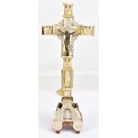 A 19th century mother of pearl and olive wood crucifix inscribed to the reverse 'Jerusalem' and