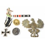 Various German Military items to include a WWI Second Class Iron Cross, two Black Wound Badges,