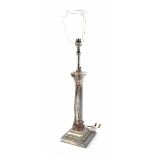 A white metal Classical-style column table lamp with reeded column and acanthus leaf decoration to