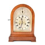 A mahogany and brass line inlaid Westminster chiming dome-topped bracket clock,