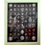 An impressive framed collection of approximately sixty 19th century heraldic Crests used as