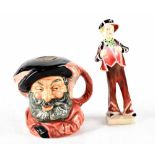 A Royal Doulton figure HN2035 'Pearly Boy' and a Royal Doulton character jug D6385 'Falstaff' (2).