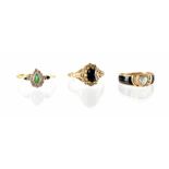 Three 9ct gold fashion rings to include an emerald and diamond heart ring with two tiny emeralds to