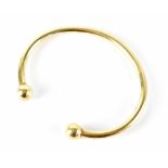 A 9ct gold torc bracelet stamped 375, approx 39.7g.