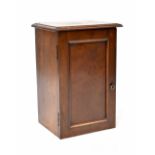 A mahogany bedside table with interior of three fitted drawers and shelves (converted from a