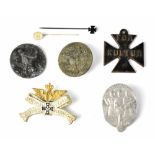 Three National Socialist German Workers' Party Day badges, an Imperial commemorative railway badge,