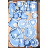 A quantity of Wedgwood blue jasper ware to include mugs, decorative baluster vases, pin dishes,