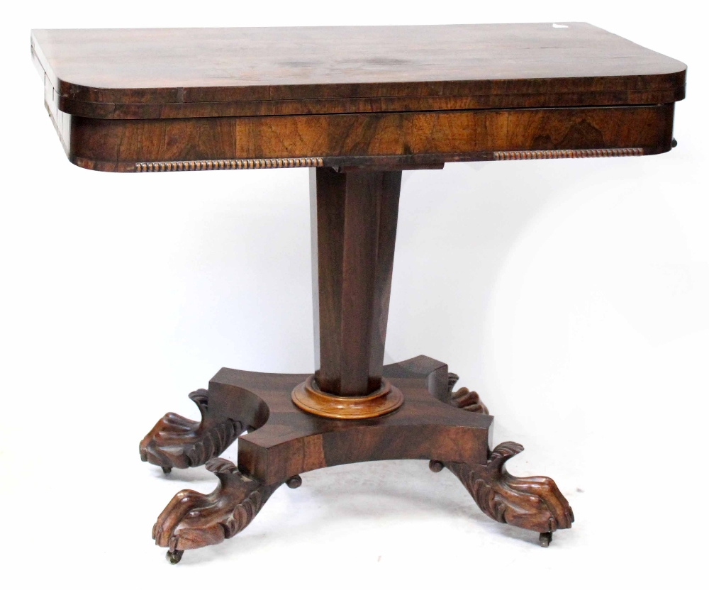 An early Victorian rosewood card table, central tapering column support to four ball and claw feet,