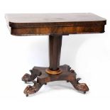 An early Victorian rosewood card table, central tapering column support to four ball and claw feet,
