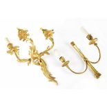 A pair of twin-branch Rococo-style gilt metal candle sconces,