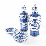 A pair of Chinese blue and white lidded vases of baluster form,