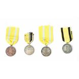 Two German Silver Class and a Bronze Class Friedrich August Medals and a Wurttemberg Service Medal