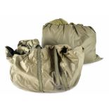 A German post-war sleeping bag with carrier and separate waterproof sleeping bag cover.