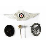 A German WWII Luftwaffe wreath and cockade, a German WWII Black Wound Award, Reichbund stick pin,