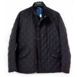 A Barbour quilted coat in dark blue with royal blue interior, size L.