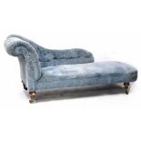 A Victorian walnut chaise longue, button-back upholstery in blue velvet,