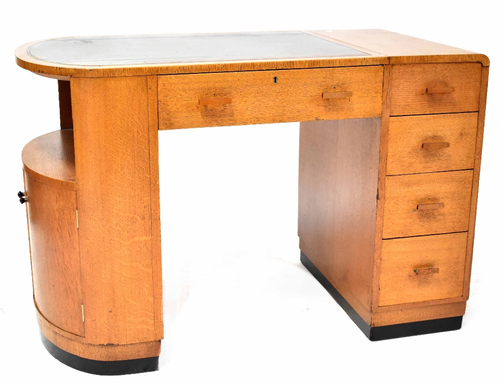 An early/mid-20th century oak Art Deco kneehole desk,