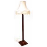 An Art Deco mahogany column standard lamp to square spreading base, height 190cm.