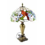 A Tiffany-style table lamp, the domed shade with cardinal birds and blue flowers,