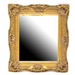 An 19th century style gilt-framed bevel-edged rectangular mirror,