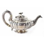 A William IV hallmarked silver teapot of square baluster form,
