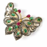 An Indian yellow metal brooch in the form of a butterfly, set with rubies,