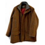 A Brooke Taverner tweed coat with quilted red satin interior.