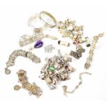 A mixed collection of mostly silver jewellery to include two solid bracelets,