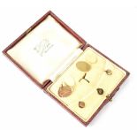 A pair of gentlemen's 15ct gold monogrammed cufflinks and three collar studs in presentation box,