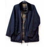 A Barbour lightweight Beaufort coat in navy blue with tartan interior, size L.