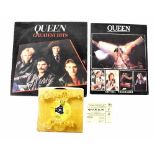 A collection of items relating to the band 'Queen' to include an official programme from the 1980