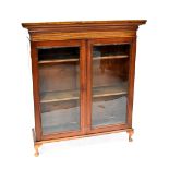 A Victorian mahogany twin-door display/book cabinet, stepped frieze above two glazed doors,