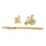 Two 9ct gold charms to include a penny farthing, a spinning wheel and a 9ct gold anklet (af),