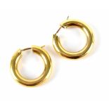 A pair of yellow metal hoop earrings, approx 5g.