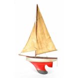 A single masted pond yacht with grey and red painted keel, length 59cm.