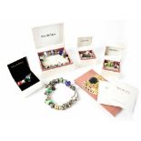 Two Pandora charm bracelets, one with twenty charms, the other with fourteen,