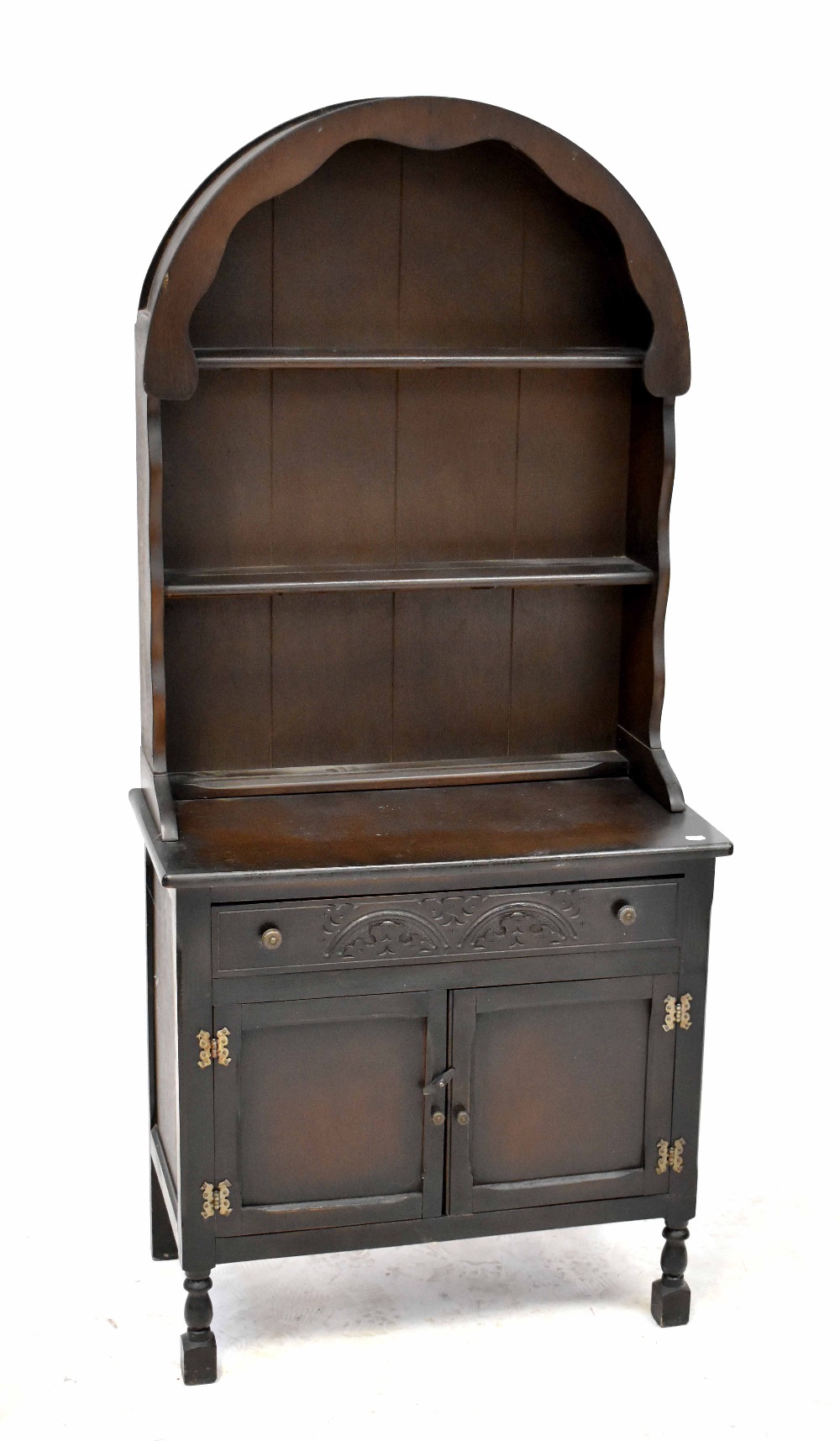 A small 20th century oak dresser with curved enclosed plate rack on a base of single drawer and