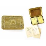 A WWI Queen Mary 1914 Christmas tin and contents to include tobacco,