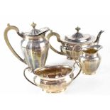 An Elizabeth II hallmarked silver four-piece tea service comprising teapot, hot water pot,