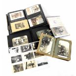 German Military Interest; four albums of various sizes containing German WWI military postcards,