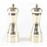 An Elizabeth II hallmarked silver pair of cruets, salt and pepper mill, P H Vogel & Co,