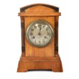 Junghens; an early 20th century mahogany cased mantel clock with applied metal decoration,