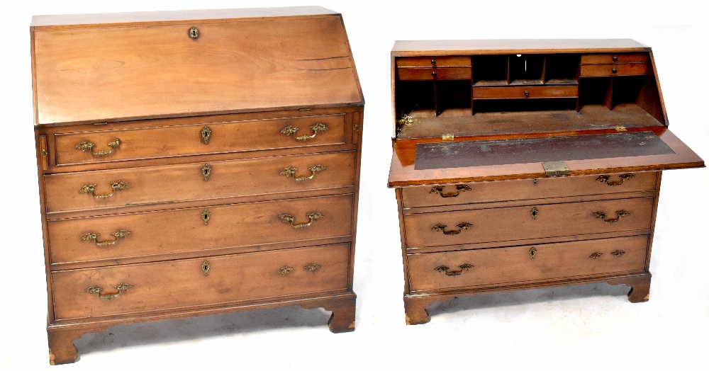 A 19th century bureau desk with drop-down desk top with interior drawers and pigeonholes with small