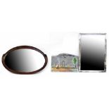 Three mirrors to include an early 20th century oval mahogany-framed wall mirror, length 80cm,