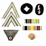 A collection of German WWI Army cloth insignia badges, two ribbon bars and a button (8).