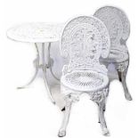 A modern white painted cast aluminium garden table and chair/patio set in the antique style,