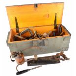 An ammunition box containing a quantity of vintage tools to include mallet, chisels,